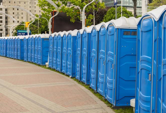 a row of portable restrooms at a fairground, offering visitors a clean and hassle-free experience in Dania Beach, FL